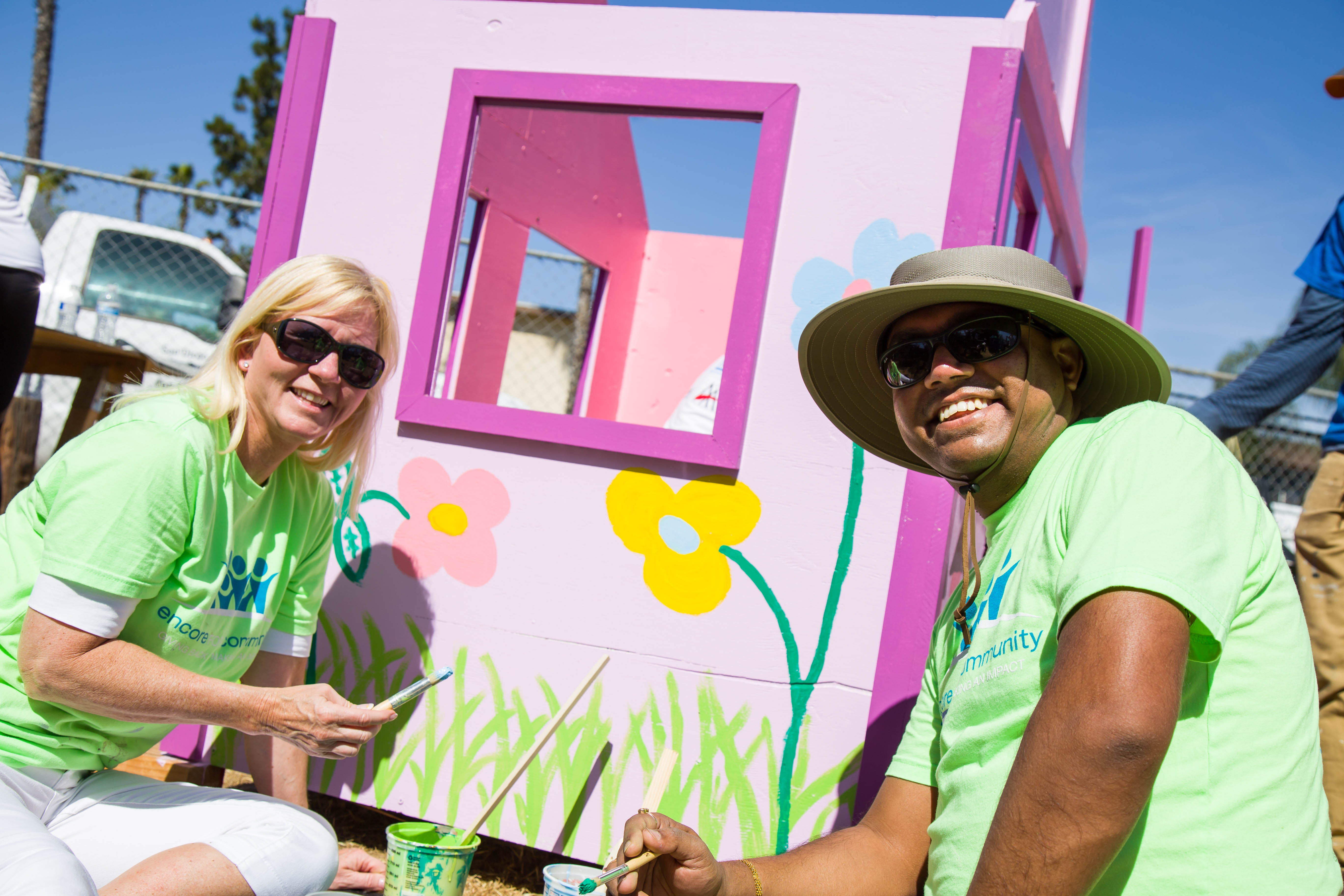 Photo of volunteers painting a wall